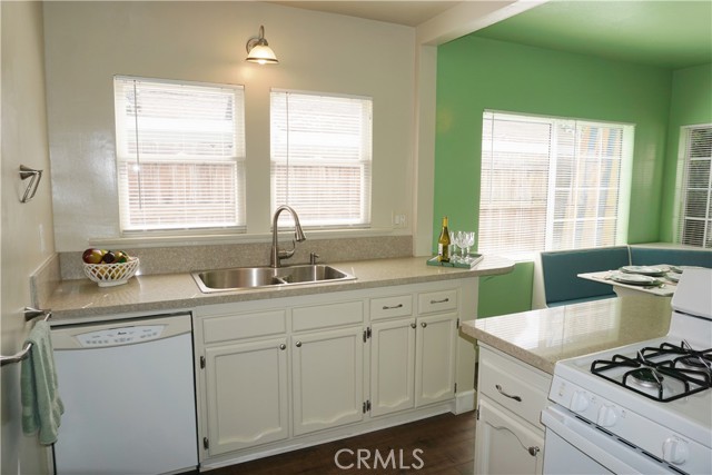 Kitchen sink area with dishwasher