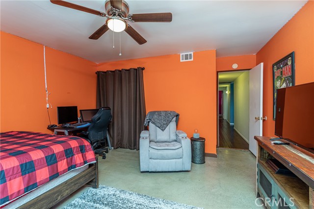 Bedroom also features concrete floors!