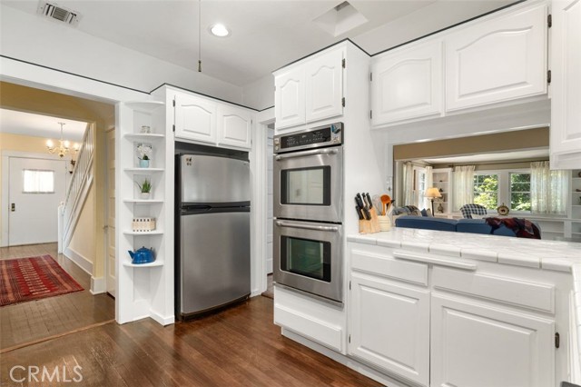 Kitchen looking to front door & on right to family room.