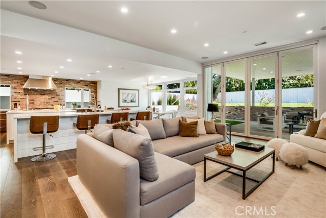 1540 Curtis Avenue Manhattan Beach, California Modern homes are often accused of lacking character, generally by those with a deep mistrust of social media, vegans and “today’s music.” Character, of course, doesn’t come from age. It comes from attitude; something that 1540 Curtis Ave has in spades. Built in 2017 by Steve Lazar, this sleek home is cooler than a Tesla carrying Frank Sinatra and the best deal in The Knolls. Gorgeous from every angle inside and out, this beauty also has brains in the form of a Savant home automation system. The open-concept first floor contains spaces – living, dining, wet bar, family – that flow effortlessly into each other and outside to the spacious rear patio and yard. Everything you see and touch is the very best, but especially in the two-of-everything (sinks, dishwashers and islands) dream kitchen with custom-paneled Gaggenau fridge & freezer. Upstairs, the massive volume and explosive light of the showcase owner's suite cement its place as the home’s pinnacle, while an additional four bedrooms and an upstairs living room ensure luxury for all. Once you head back downstairs, you’ll find yourself within walking distance of both Mira Costa and Pennekamp. This convenience – combined with the home’s luxury, style, tech and space – means that 1540 Curtis Ave is more than just a home with character. It’s timeless.