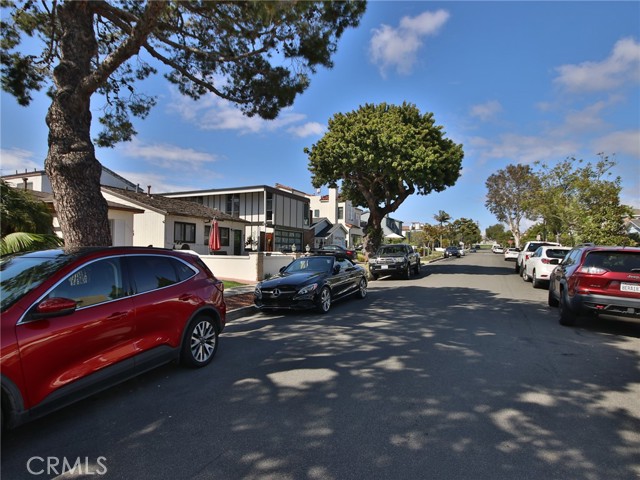 View of street.  There is a public park at the end and you are close to shopping and restaurants on Pacific Coast Highway and it is a short 4  block walk to the Corona Del Mar State Beach.