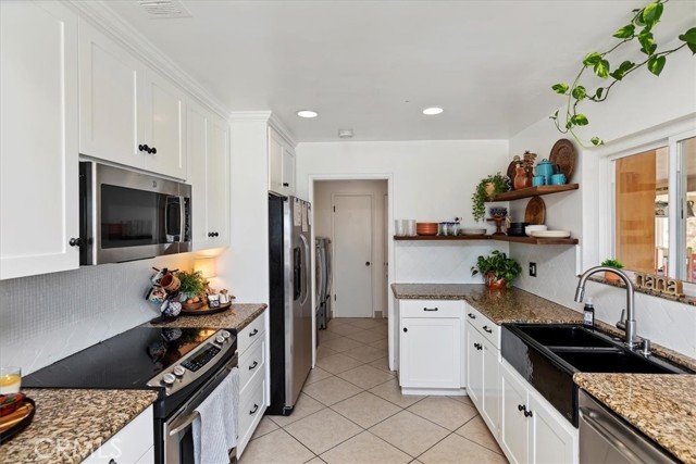 Kitchen with view towards laundry room