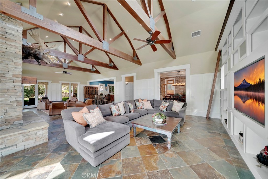 another view of great room with open beam ceiling