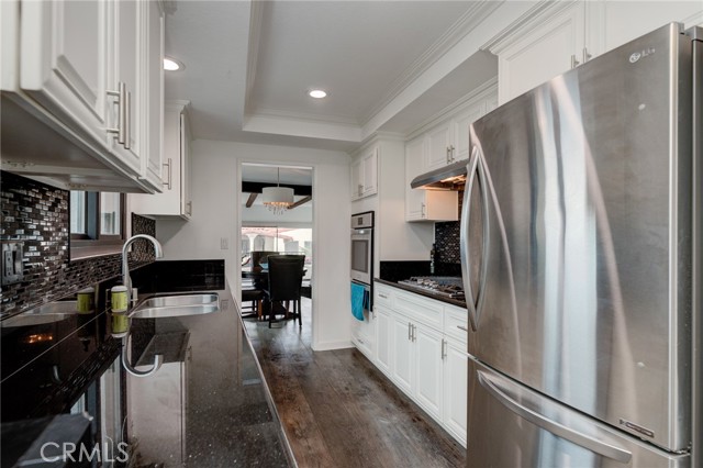 Lovely galley kitchen with stainless appliances