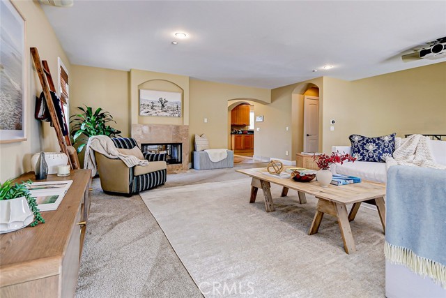 Large living room with dual sided fireplace shared with dining room