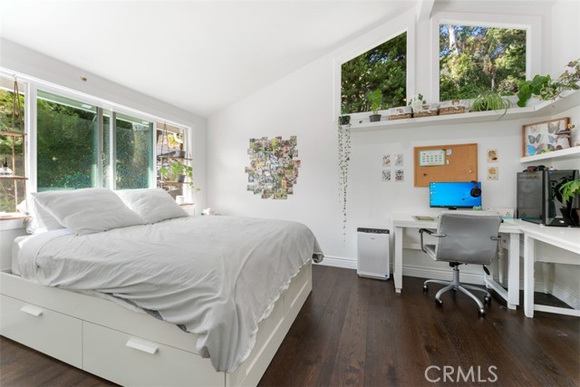 Upstiars bedroom with queen bed and work station