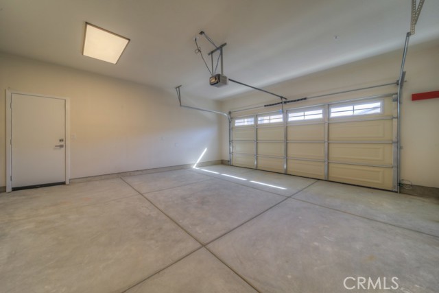 Large 2 Car Garage. • Fully insulated garage, including walls.