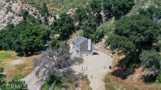 THIS HOME IS SURROUNDED BY ALL THAT NATURE HAS TO OFFER.