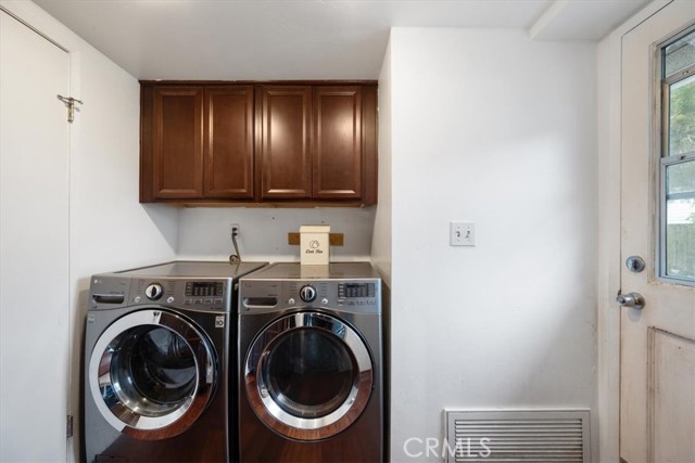 Separate laundry area with access to the backyard and garage.  Washer and Dryer included in the sale