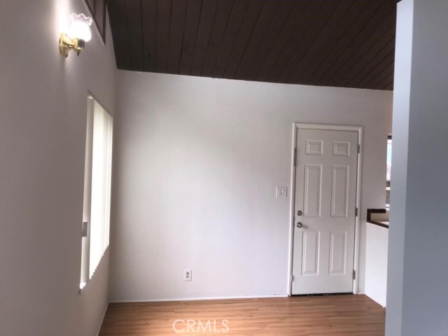 Dining area off the kitchen.  Door leads to back walkway which leads to shared laundry room.