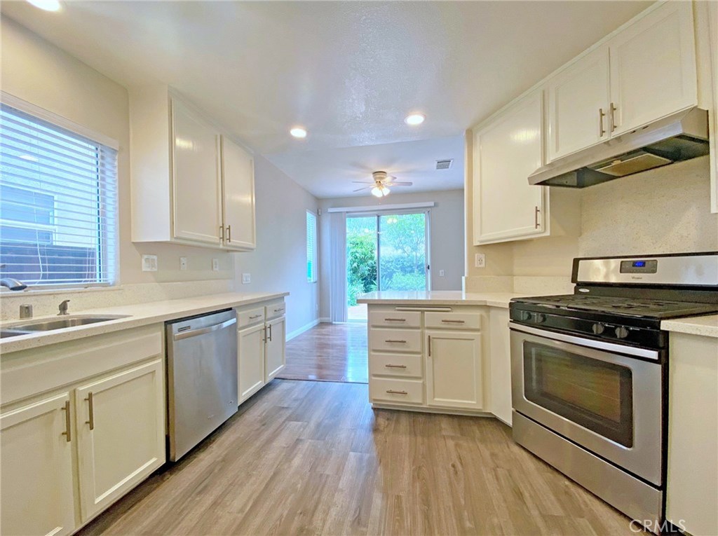 Beautiful home in prime Aliso Viejo neighborhood of the Pointe offers gated security and executive living.  This home shows like a model--nothing has been overlooked.  Upscale living features include exquisite wood flooring throughout and custom Kitchen with top quality quartz counter tops, freshly painted white kitchen cabinets, and stainless steel appliances, new paint throughout, newer faucets and shower head, and more. Downstairs floor plan has wonderful vaulted ceilings in living room after stepping through a formal entry.  Enjoy the fireplace during those cold winter nights.  The spacious dining room is open to the kitchen, and there is also a powder room for guests.  Upstairs are 3 good size bedrooms and 2 full baths.  There is also a small open loft perfect for a study area or office.  Outside is an ample sized backyard with hardscape features perfect for outdoor living.  Attached two car garage has direct access into home. This is not your ordinary rental home.  Come now and enjoy living in anew home quality residence.
