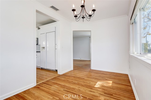 Dining room is spacious overlooking the front yard and adjacent to the kitchen.