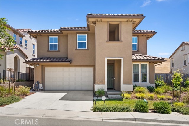 This 2019-built single-family home is nestled in a quiet community, with 2,275 sqft of living space on a 6,050 sqft lot. The backyard offers mountain views and no rear neighbors. It features 4 bedrooms, a loft, and 3 bathrooms, including a main-level bedroom for guests. The kitchen boasts quartz countertops, stainless steel appliances, a 4-burner gas cooktop, an upgraded Fotile range hood, recessed lighting, an island bar, and a walk-in pantry. The master suite includes a luxurious bathroom with a stall shower and sunken bath, plus a walk-in closet. Additional features include an upstairs loft, laundry room, instant hot water heater, whole house fan, 2-zone HVAC, and dual-pane windows. The backyard has new concrete paving, and the front landscaping is maintained by the HOA. Conveniently close to the Vallejo Ferry Terminal, this home is a must-see!