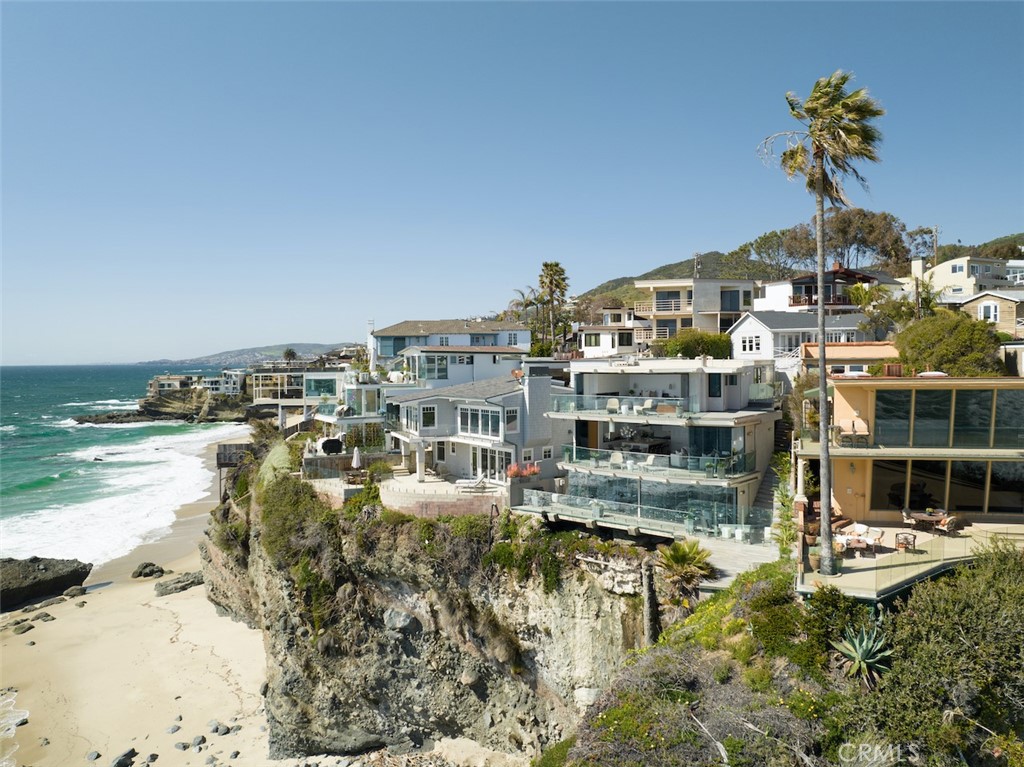 A divine oceanfront estate in gorgeous Laguna Beach, 31885 Circle Drive pairs private street beach access with thoughtful contemporary design and breathtaking views of the coastline and Catalina Island beyond. Exquisite in contemporary architectural style, detail and function, this four-bedroom, six-bath, 3417-square-foot, three-level estate soaks in sweeping ocean and coastline views from frameless glass walls on every level. The result from a decade of thoughtful design and meticulous construction by a renowned local architect and builder, 31885 Circle Drive blends modern interiors with inviting natural finishes and ambiance-enhancing natural light. Three comfortable outdoor terraces are primed for seamless entertaining and relaxing with heaters and audio system integration. Additional home features include four fireplaces, an HD premium theater room, clear pneumatic vacuum elevator which services all three levels while offering sea views and leading-edge smart home system with camera and security system that allow complete control from any location. This home’s magical environment overlooks a sandy cove, coastline to the south and north and convenience access to the famed Thousand Steps Beach. 31885 Circle Drive is also mere minutes from local trails, shops, restaraunts and resorts. Shown by appointment.