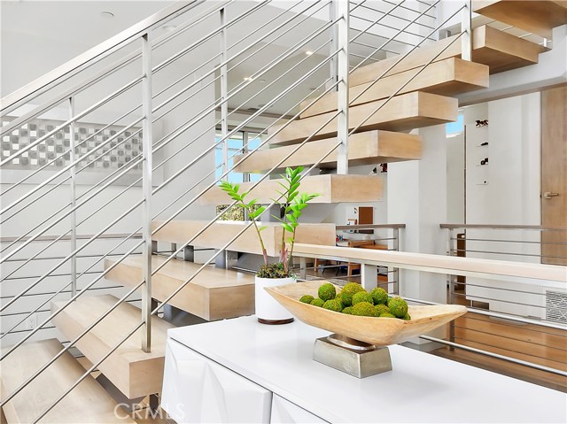 Floating staircases throughout.