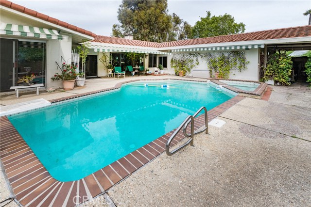 Pool looking at back of home.