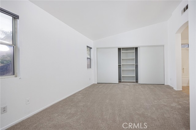 Primary bedroom suite with new carpet