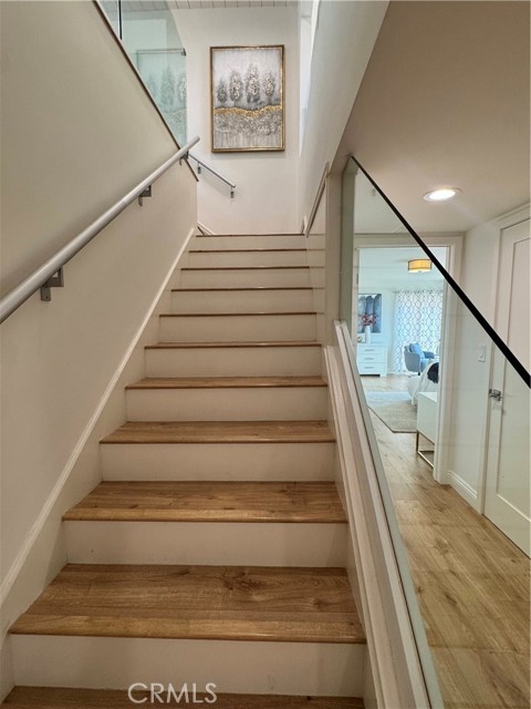 staircase with glass railings