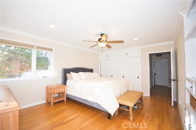 The main level Master Bedroom opens to the upstairs deck and overlooks beautiful views of green rolling hills.