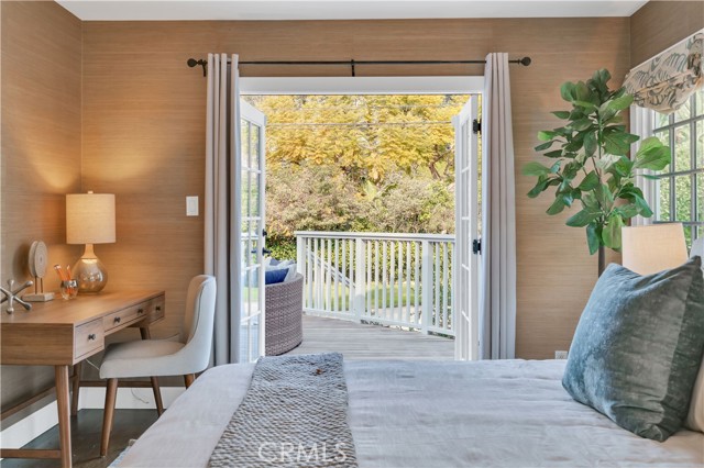 Bedroom 2 with access to exterior deck & backyard