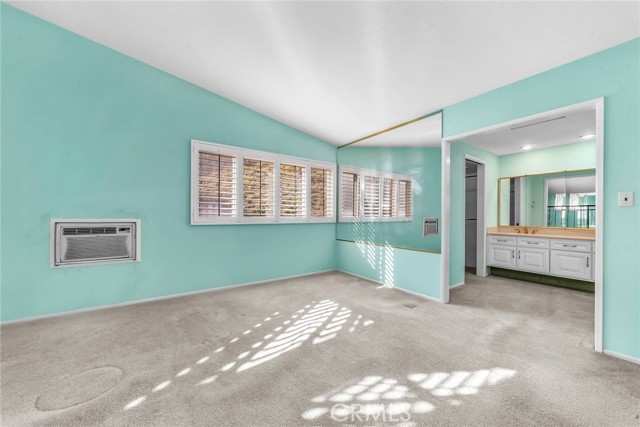 Master Bedroom sitting area.  Entrance to walk-in closet
Home is air-conditioned.  Wall Unit was installed for economical purposes