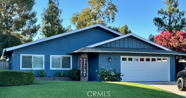 25077 Green Mill Avenue Newhall, California Location, Location, Location. Beautiful, complete Remodel, Must See! This gem of a home is located near the end of a cul-de-sac, with private yard and mature trees just waiting for a new owner. This newly renovated home offers 4 Bedrooms and 2 beautiful bathrooms. The Kitchen is centered directly between the family room and the dining area leading to the breathtaking outdoor area. Brand new flooring with 6" base throughout the house. All bedrooms have new carpet, closet doors, entry doors with matching black hardware throughout. All windows and sliders are new, including newly installed wood shutters throughout the entire home. The backyard is indeed private with planters, grassy area a separate workshop with A/C. The 2-car garage is completely remodeled; new garage door and flooring redone. No HOA or Mello Roos taxes!
