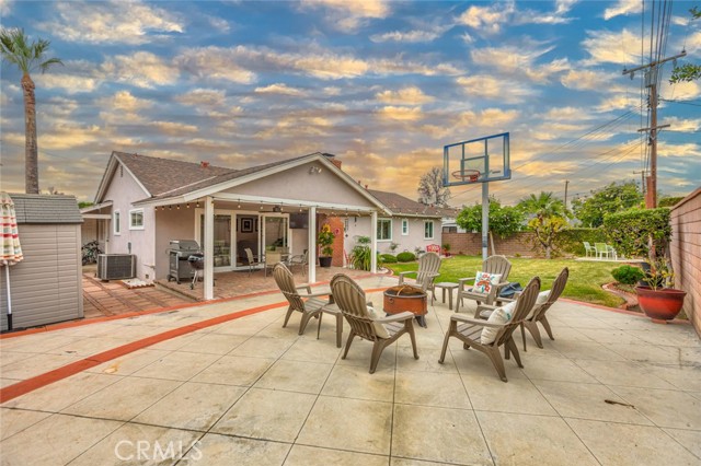 Backyard has ample sitting and play area for children or pets