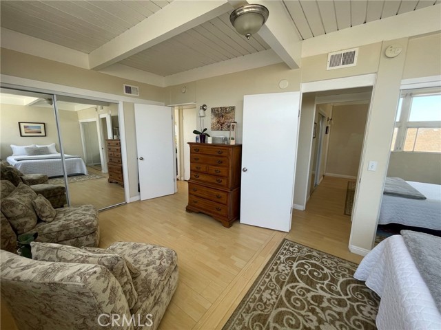Large Main Bedroom with double mirrored closets and double entry.