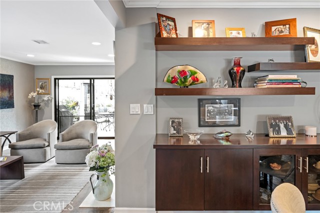 Looking into one of the living areas with that beautiful custom built-in cabinet.