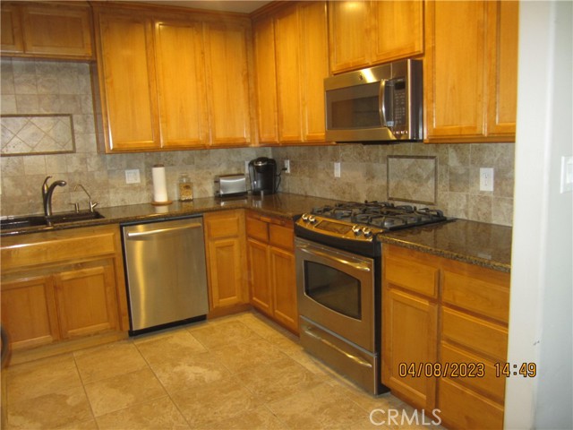 Kitchen with Granite Counters and Tile Flooring