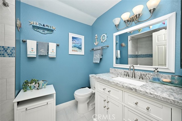 Charming, remodeled bath with sizeable vanity.