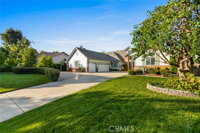 The expansive yard and mature landscape are so lush and beautiful. Just look at all this parking!
