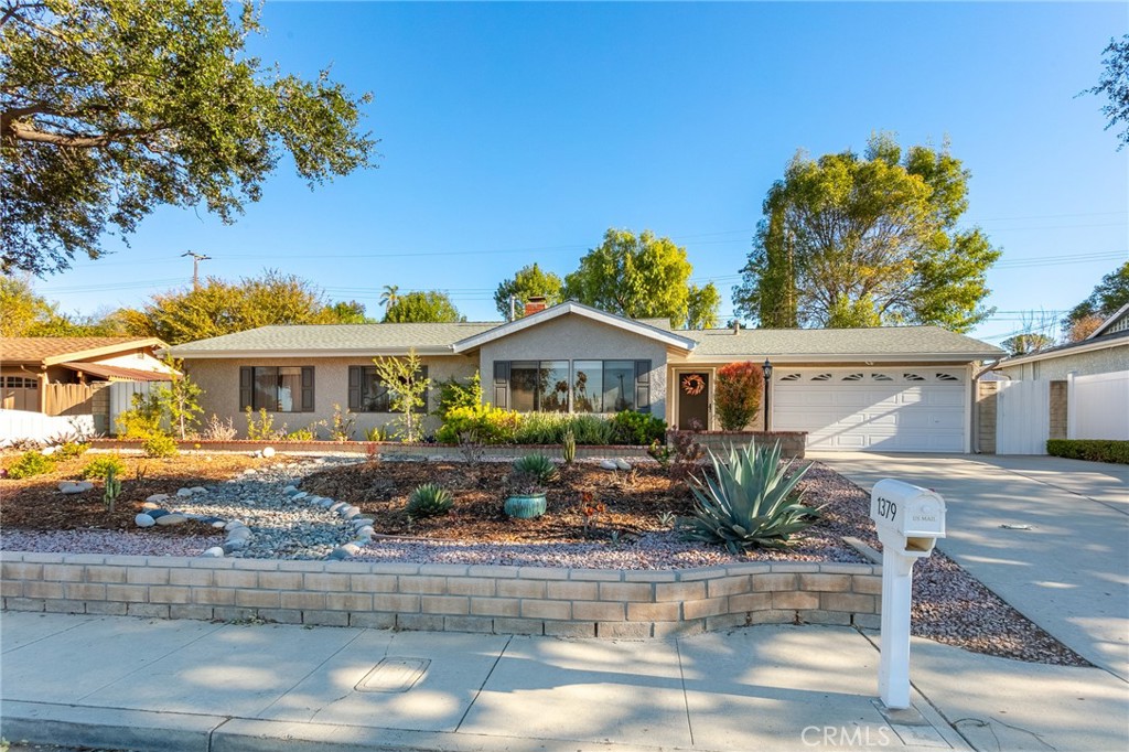 Welcome to this beautifully upgraded single-story home in the heart of Thousand Oaks! Featuring 3 bedrooms, 2 bathrooms and an inviting backyard perfect for the burgeoning gardener, this home exudes charm and comfort. The kitchen comes with quartz countertops, stainless steel appliances and ample counter space for your creations. Vinyl flooring and useful built-ins near the front door open to a cozy, light-filled living area. You can unwind by the fireplace in the dining area and then step through the double doors to the spacious covered patio with built-in BBQ and fire pit — ideal for hosting gatherings. A delightful greenhouse sits nearby with plenty of shelves for your sprouts and potted plants. The terraced backyard includes brick stairs that lead to an upper-level garden, where you can grow vegetables and soak in the breathtaking views. This home also features central air conditioning for year-round comfort and a low-maintenance, drought-resistant front yard. Ideally located near freeways, shopping, top-rated schools and various amenities, this turn-key home is ready for you to move in and make your own. Don't let this gem slip away!