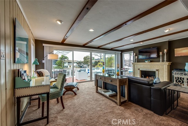 The open living room extends to the deck and Rivo Alto canal.