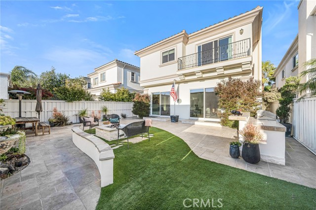 hardscape backyard with built-in BBQ and fire pit