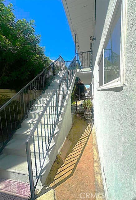 There is a Second Rear Stairway Adjacent to the Garages Leading to the Upper Level. There is a Second Rear Stairway Adjacent to the Garages Leading to the Upper Level.