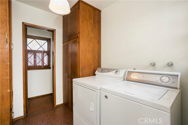 Indoor laundry and half bath, plus extra storage.