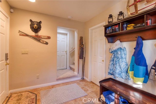 Mud room, heading upstairs and to the garage