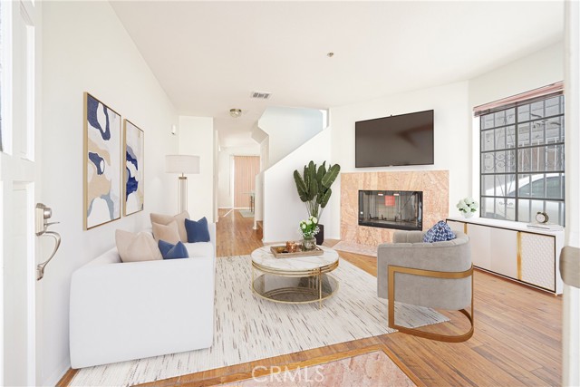 Entry Living Room with a fireplace