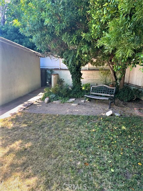The Large Rear Yard has Shady Mature Trees and Landscaping