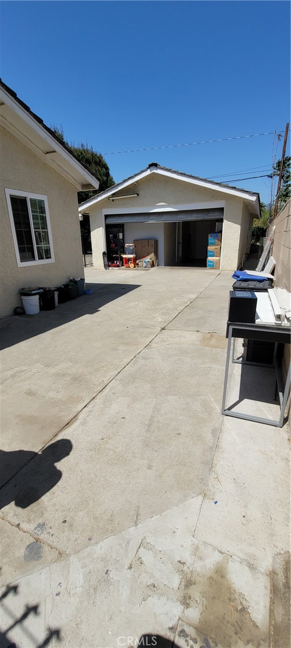 Detached garage located in the back yard.  Cemented driveway throughout the backyard.