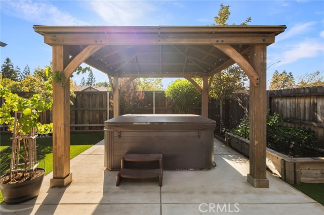 Raised garden beds and gazebo with 220v electrical & string lights for evenings spent outside!