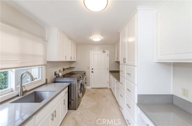 Laundry area leads to garage door