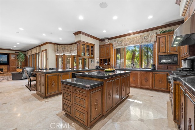 Chef's kitchen with granite counters, center island, and plenty of storage.