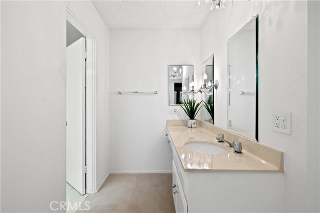 The primary suite is a spacious bedroom closet, and primary bath with dual vanities.