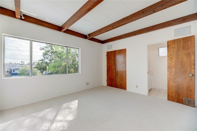 Primary Bedroom with Tree Top Views