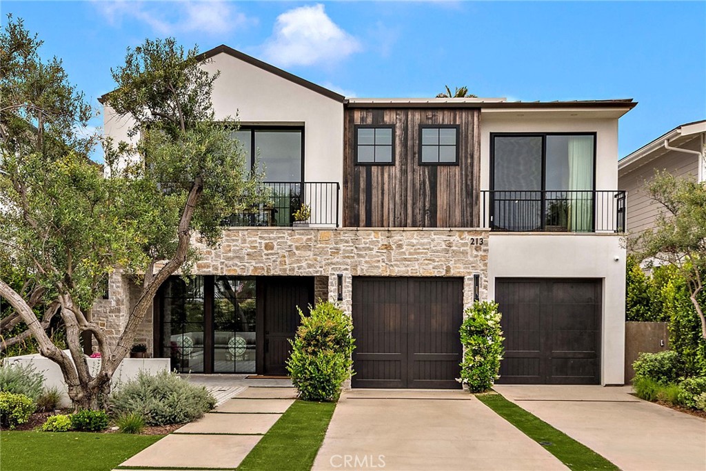 Experience exceptional design, unparalleled quality, and an enviable lifestyle in this custom-built residence by Casa Arte Group, ideally situated in Southwest San Clemente’s coveted Lasuen neighborhood. Thoughtfully designed for seamless indoor-outdoor living, this architectural gem pairs refined coastal luxury with meticulous craftsmanship and cutting-edge technology—creating one of the finest newer homes available. Enjoy effortless access to the beach trail, San Clemente Pier, and Avenida Del Mar. Whether you surf, golf, or unwind by the sea, this home offers a permanent staycation mindset. After a sun-soaked day, relax in the year-round hot tub or gather on the expansive rooftop deck with stunning ocean and sunset views, plumbed for a grill and outdoor kitchen. Spanning approximately 3,901 square feet across two stories with a third-level rooftop deck, the home features 4 bedrooms, 4.5 bathrooms, and an open layout enhanced by 9’6” ceilings and Warren Christopher wide-plank wood flooring. The exterior is finished in smooth Santa Barbara stucco with a standing seam aluminum roof and professionally landscaped grounds. The vaulted, covered outdoor patio includes a fireplace, grill, refrigerator, hot tub, and outdoor shower. Inside, the kitchen showcases all Rift Oak European-style cabinetry, quartzite countertops, and an exceptional suite of Miele appliances—highlighted by an 8-burner cooktop, 3 ovens, and dual Sub-Zero refrigerator and freezer. A walk-in pantry connects to a full prep kitchen. The main floor includes a guest bedroom and full bath, while upstairs, the ocean-view primary suite offers a private balcony, fireplace, and custom walk-in oak closet. The spa-like primary bath features dual sinks, custom tile, a 72” freestanding soaking tub, and a rain shower with frameless glass enclosure. Two additional en-suite bedrooms upstairs feature custom oak closets and designer tile work, while a dedicated office with built-in cabinetry adds flexibility. Additional features include a Sonos audio system, Apple in-wall controller, Ring doorbell, solar, LifeSource water filtration, 2 EV charging stations, and smart garage openers—making this a turnkey opportunity for elevated, modern California living.