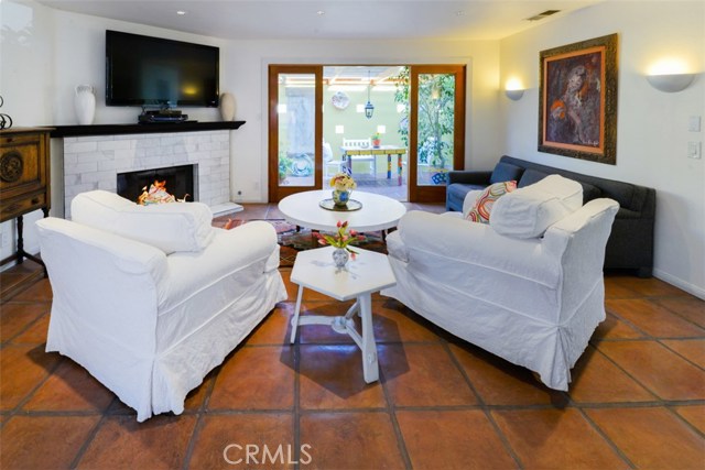 View of the patio from the family room.  The doors dividing the two spaces are sliding panel doors.