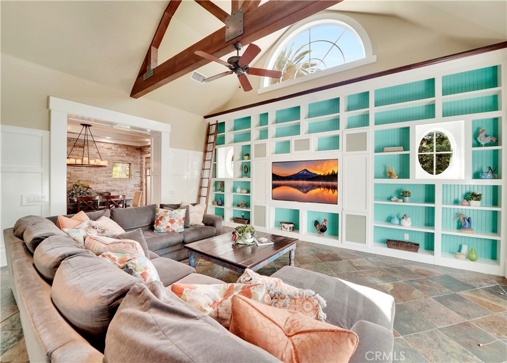 gorgeous custom shelving and custom window in great room