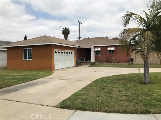 This house is located on a corner lot and features a spacious floor plan with a living room and a family room with a fireplace. The kitchen has a tiled floor, granite countertops, recessed lighting, and a built-in dining bench. Separate laundry room next to the kitchen. The house has 4 bedrooms and 3 bathrooms. Cover patio area for those summertime BBQs. Two car garage. Easy access to 57,5, and 91 freeways.